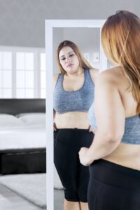 Woman looking at mirror